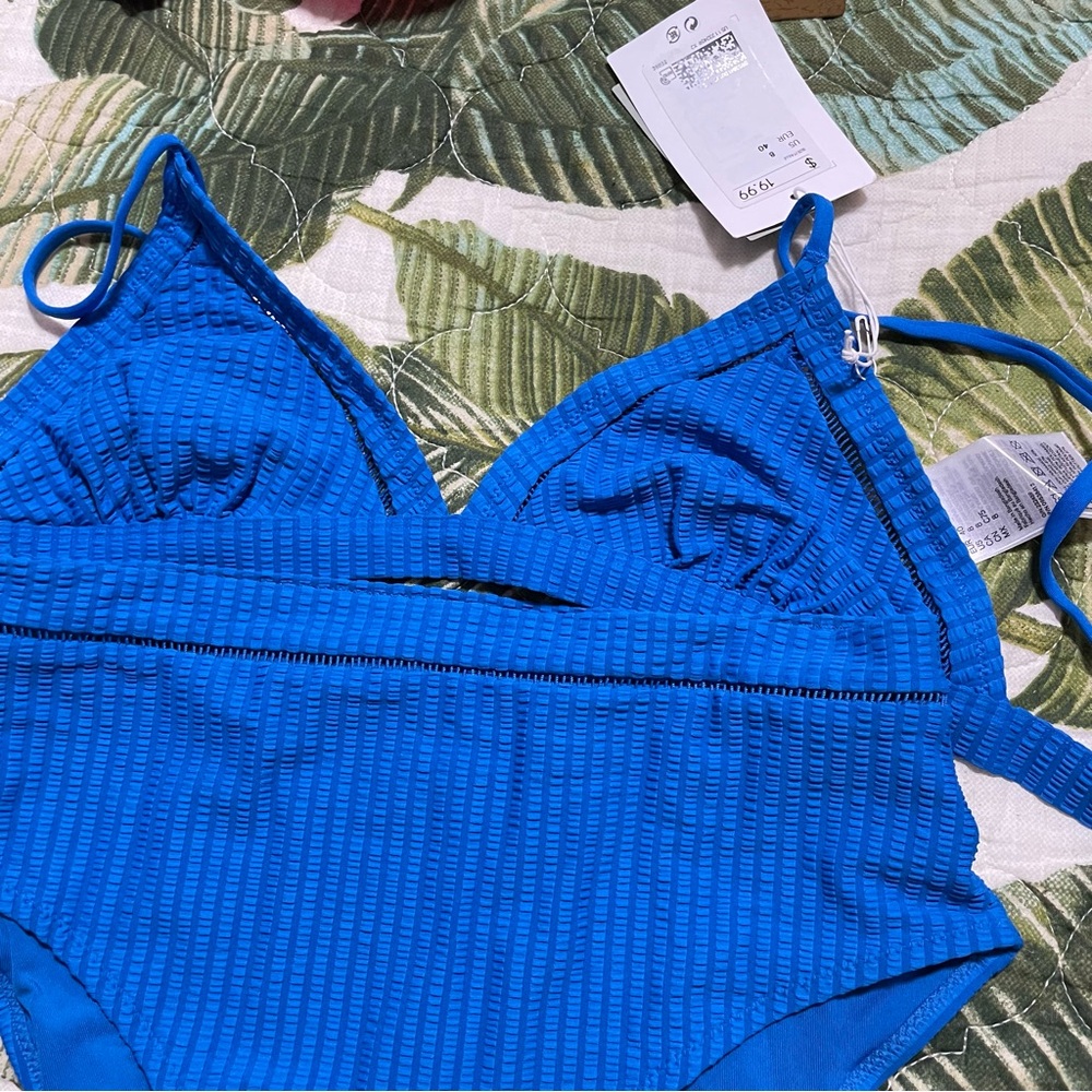 H$M lemlem collab swim in a beautiful blue. Size 8 top and bottom